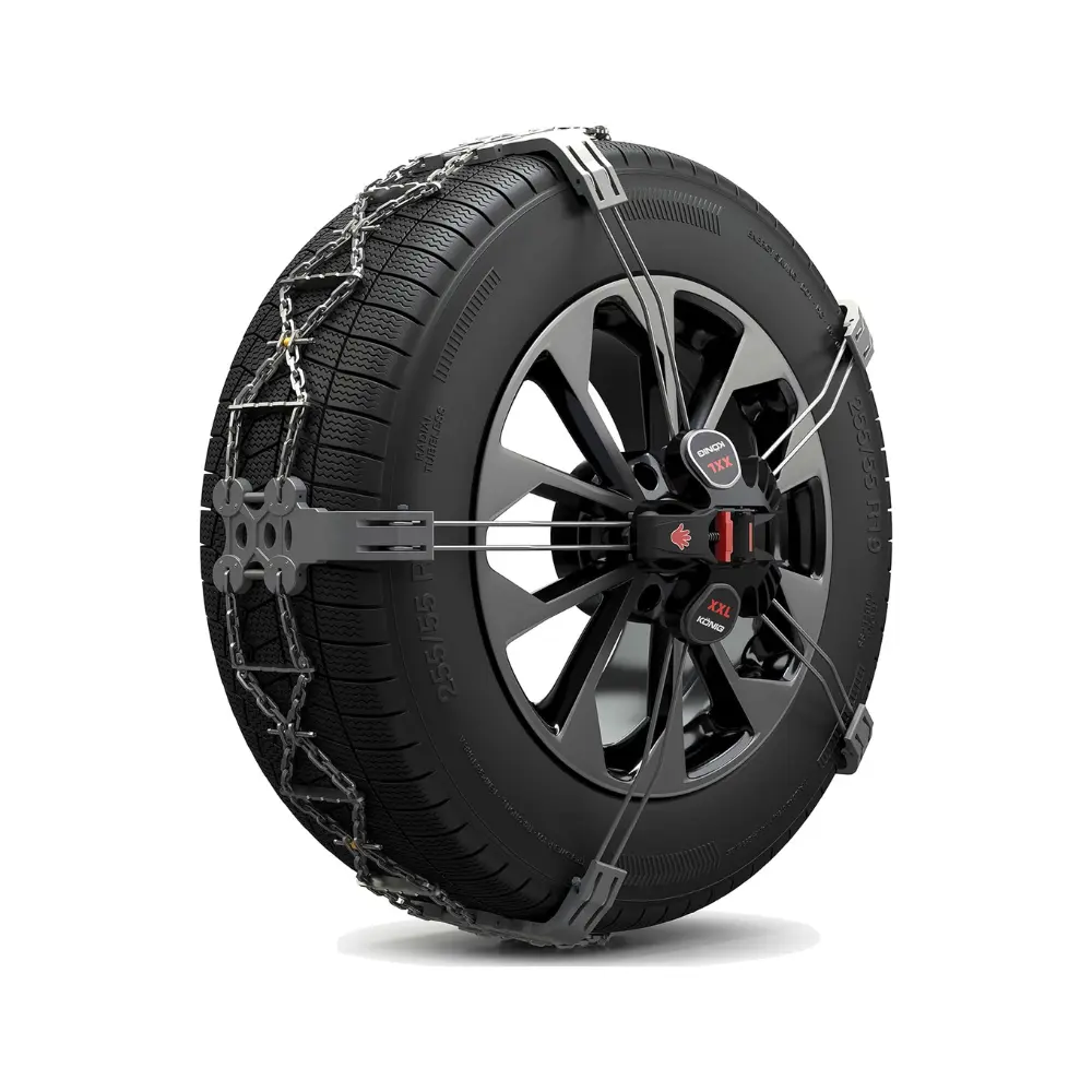 Thule K-Summit snow chains mounted on car tire with external fixation system and high-performance metal traction arms